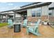 Backyard with stamped concrete patio and Adirondack chairs surrounding a fire pit, perfect for entertaining at 3365 S Poppy St, Morrison, CO 80465