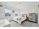 Cozy bedroom with gray carpet, work desk and two windows allowing natural light at 3365 S Poppy St, Morrison, CO 80465