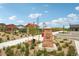 Community sign and landscaped entrance to residential neighborhood, with playground and outdoor recreation areas at 3365 S Poppy St, Morrison, CO 80465