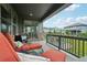 Inviting covered patio with lounge seating, perfect for enjoying outdoor living and neighborhood views at 3365 S Poppy St, Morrison, CO 80465