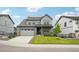 Attractive two-story home with an attached garage and a covered front porch at 3365 S Poppy St, Morrison, CO 80465