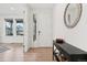 Bright foyer with hardwood floors, a console table, and a decorative mirror at 3365 S Poppy St, Morrison, CO 80465