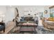 Spacious living room boasts an open-concept layout with hardwood floors, modern lighting, and stylish décor at 3365 S Poppy St, Morrison, CO 80465
