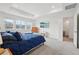 Spacious main bedroom with a tray ceiling, large windows, and light gray carpet at 3365 S Poppy St, Morrison, CO 80465