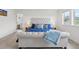 Comfortable bedroom featuring a tufted headboard, two bedside tables, and luxury bedding at 3365 S Poppy St, Morrison, CO 80465