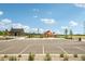 View of the community playground, parking lot and neighboring community buildings in a residential neighborhood at 3365 S Poppy St, Morrison, CO 80465