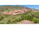 Breathtaking aerial view of Red Rocks Amphitheater park area with unique rock formations and lush landscape at 14422 Pansy Loop, Morrison, CO 80465