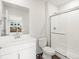 Modern bathroom featuring a glass-enclosed shower, sleek fixtures, and a white vanity at 14422 Pansy Loop, Morrison, CO 80465