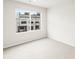 Bright, carpeted bedroom with large window at 14422 Pansy Loop, Morrison, CO 80465