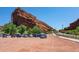 Scenic parking area near Red Rocks Amphitheater, nestled among trees and sandstone formations under a clear sky at 14422 Pansy Loop, Morrison, CO 80465