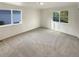 Cozy bedroom featuring neutral carpet, ample light and plenty of space at 14822 E Adriatic Pl, Aurora, CO 80014