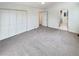 Bright bedroom features carpeted floors and large closet at 14822 E Adriatic Pl, Aurora, CO 80014