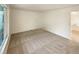 Bright bedroom featuring neutral carpet and natural light from a large window at 14822 E Adriatic Pl, Aurora, CO 80014