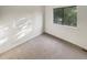 Carpeted bedroom with view from the window at 14822 E Adriatic Pl, Aurora, CO 80014