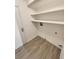 Convenient laundry room with shelves and flooring at 14822 E Adriatic Pl, Aurora, CO 80014