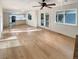 Bright living room features hardwood floors, windows with a view, and sliding glass doors to the backyard at 14822 E Adriatic Pl, Aurora, CO 80014
