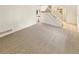 Spacious living room with neutral carpet and bright, natural light at 14822 E Adriatic Pl, Aurora, CO 80014