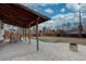 Expansive backyard with a covered patio, fire pit, and landscaping, offering relaxation and entertainment space at 5191 S Logan St, Littleton, CO 80121