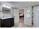 Contemporary bathroom featuring a glass shower, vanity with storage, and modern fixtures, offering style and functionality at 5191 S Logan St, Littleton, CO 80121