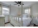 Bright bedroom with a four-poster bed, hardwood floors, and natural light at 5191 S Logan St, Littleton, CO 80121