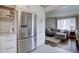 Bright kitchen featuring stainless steel appliances and a view of the living room at 5191 S Logan St, Littleton, CO 80121