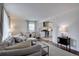 Open-concept living room with a view into the kitchen and dining area at 5191 S Logan St, Littleton, CO 80121