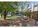 Backyard featuring a hammock and landscaping with rock paths and lush trees at 17162 E Atlantic Pl, Aurora, CO 80013