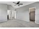 A carpeted bedroom with walk-in closet and ensuite bathroom at 17162 E Atlantic Pl, Aurora, CO 80013