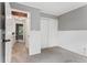 Cozy bedroom featuring gray walls and carpet with white trim and closet at 17162 E Atlantic Pl, Aurora, CO 80013