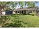 Ranch style home with stone and siding and a large lawn at 17162 E Atlantic Pl, Aurora, CO 80013