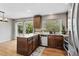 Beautiful kitchen featuring dark wood cabinets and stainless steel appliances at 17162 E Atlantic Pl, Aurora, CO 80013
