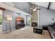 Open living room with vaulted ceilings, brick fireplace and carpeted floors at 17162 E Atlantic Pl, Aurora, CO 80013
