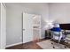 Office space with wood floors and an open door to the stairwell at 17162 E Atlantic Pl, Aurora, CO 80013