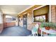 Inviting enclosed front porch area with brick walls, perfect for relaxing or greeting guests at 4169 Hooker St, Denver, CO 80211
