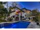 Stunning backyard featuring a sparkling pool, patio area, and lush landscaping for relaxation and entertaining at 6961 Salvia St, Arvada, CO 80007