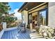 Balcony with seating, overlooks outdoor scenery; entry to bedroom at 6961 Salvia St, Arvada, CO 80007