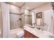 Bathroom featuring a shower and tub combination and granite countertop at 6961 Salvia St, Arvada, CO 80007