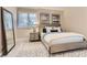 Bright bedroom with neutral tones and a full-length mirror at 6961 Salvia St, Arvada, CO 80007