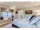 Cozy bedroom featuring a window seat with plush pillows and soft natural light at 6961 Salvia St, Arvada, CO 80007