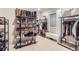 Spacious walk-in closet with organized shelves and racks for shoes, clothes, and accessories at 6961 Salvia St, Arvada, CO 80007