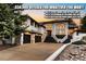 Gorgeous exterior view featuring a three-car garage, landscaped yard, and modern architectural design at 6961 Salvia St, Arvada, CO 80007