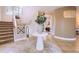 Welcoming foyer with tile flooring, staircase, and stylish decor that is perfect for guests at 6961 Salvia St, Arvada, CO 80007