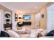 Inviting living room with plush seating, stylish decor, and a large flatscreen TV at 6961 Salvia St, Arvada, CO 80007