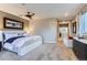 Spacious main bedroom with a curved wall and a doorway to another room at 6961 Salvia St, Arvada, CO 80007