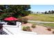 Elevated outdoor space for entertaining, with comfortable seating and views of the surrounding golf course at 6961 Salvia St, Arvada, CO 80007