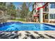 Sparkling pool with built in steps, ideal for relaxation and recreation in a private backyard oasis at 6961 Salvia St, Arvada, CO 80007