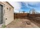 Small backyard patio with wooden walls and a view of the sky at 2600 S Downing St, Denver, CO 80210