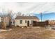 Backyard view showing a home, wooden fence and yard at 2600 S Downing St, Denver, CO 80210