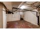 Unfinished basement with plumbing, water heater, and access door at 2600 S Downing St, Denver, CO 80210