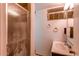 Small bathroom with shower, sink, and medicine cabinet at 2600 S Downing St, Denver, CO 80210